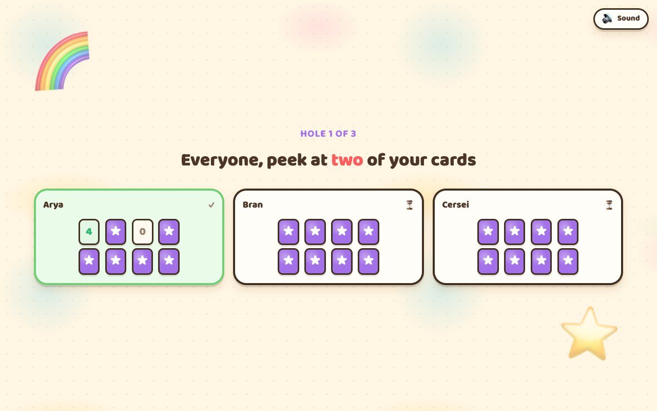 The Play Nine TV during setup: three grids of eight cards, mostly face down, with a couple turned up in each