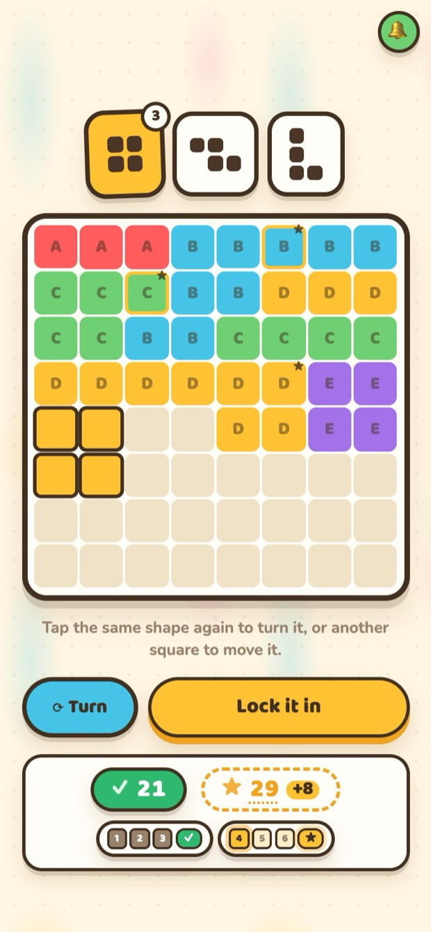 The same game on a phone: three shape cards to choose from, the grid below, and Turn and Lock it in buttons.